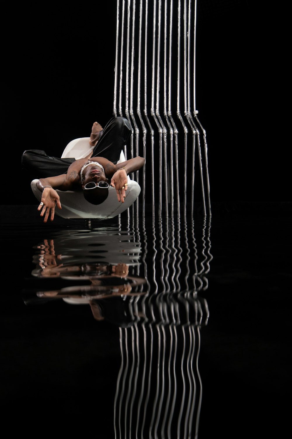 a person lying on a chair