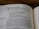 A close-up of an open book showing a page from the Old Testament. The text includes biblical verses and instructions about making vows to God. The page number 500 is seen at the top.