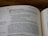 A close-up of an open book showing a page from the Old Testament. The text includes biblical verses and instructions about making vows to God. The page number 500 is seen at the top.