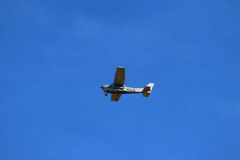 a small airplane flying in the sky