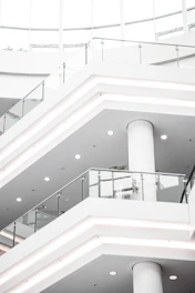 a white staircase with white railings