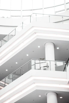 a white staircase with white railings