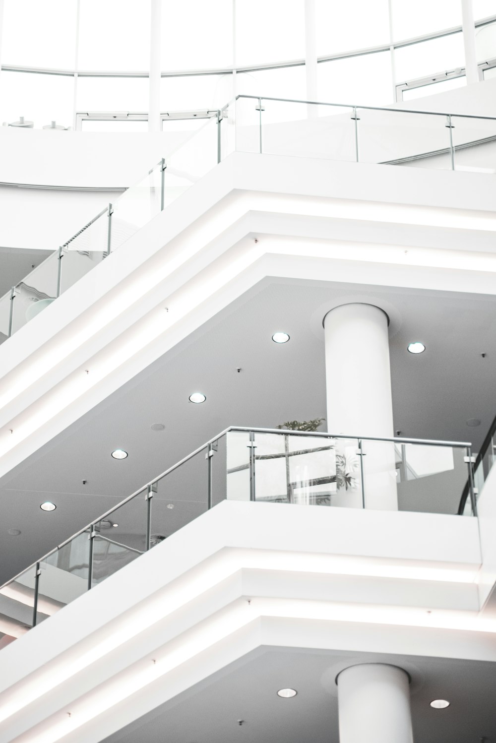 a white staircase with white railings