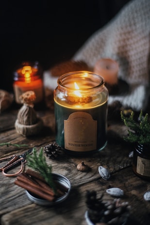 a candle in a glass jar