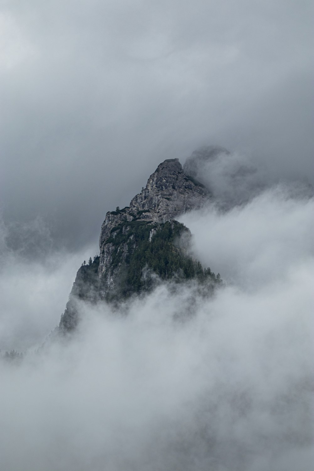 a mountain covered in clouds