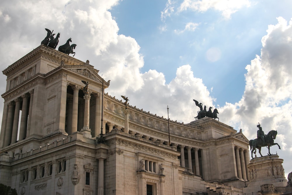 a building with statues on top