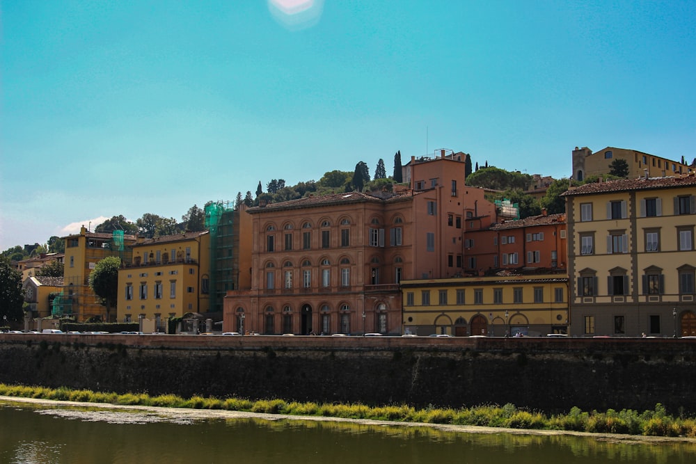 a group of buildings next to a body of water