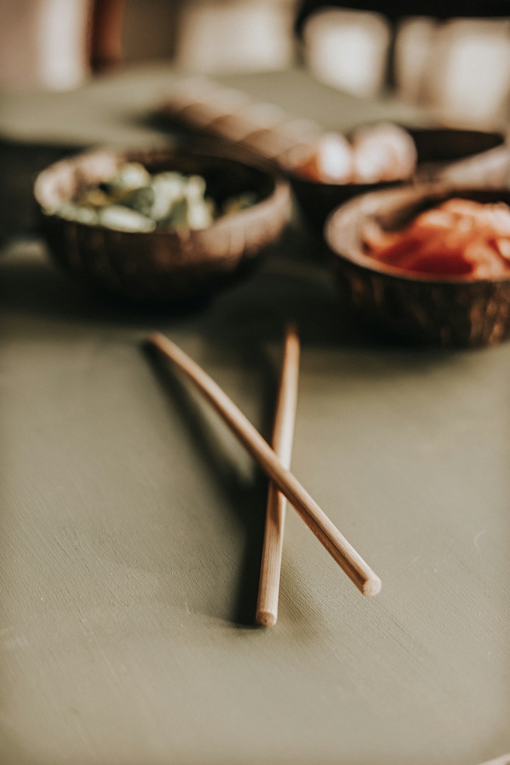 a group of wooden spoons with food in them