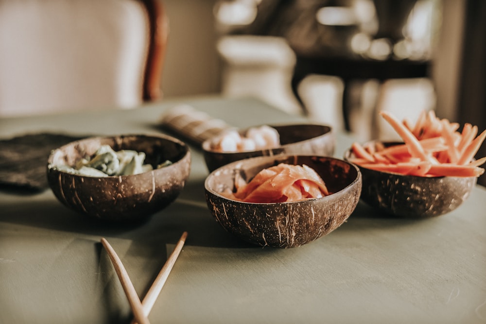 a group of bowls with food in it