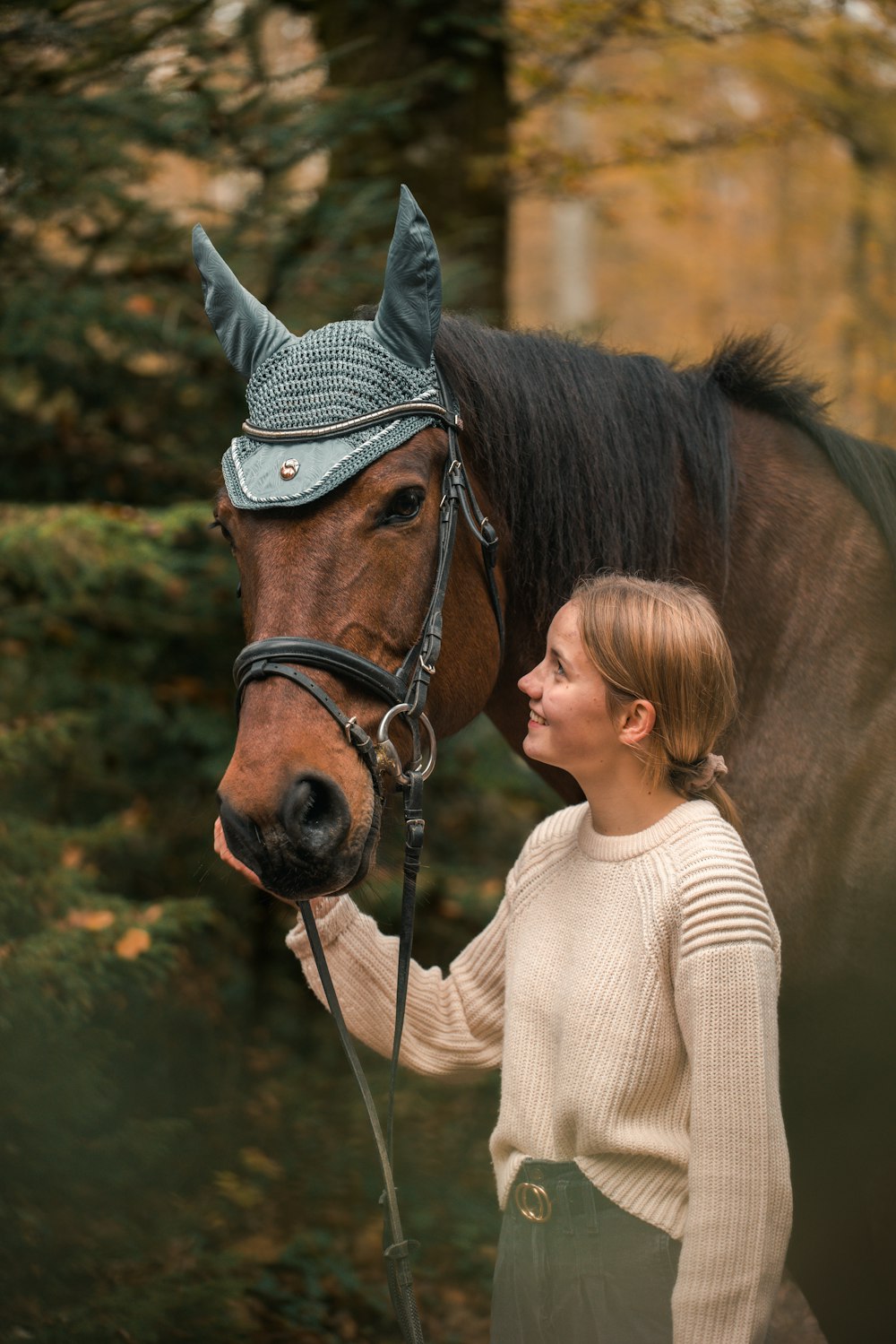 a person kissing a horse