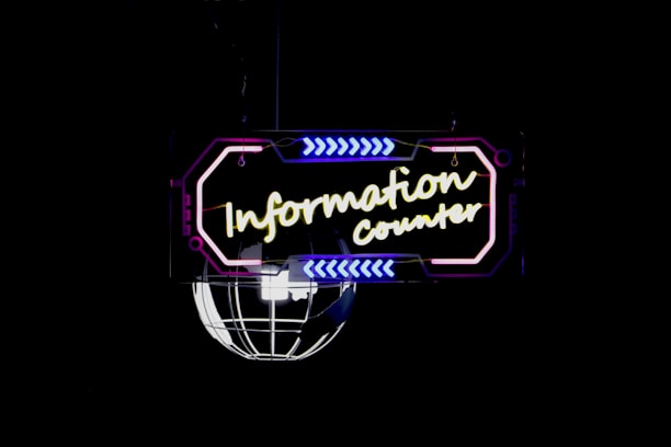 a neon sign with yellow and blue text