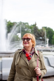 a person wearing sunglasses and a coat