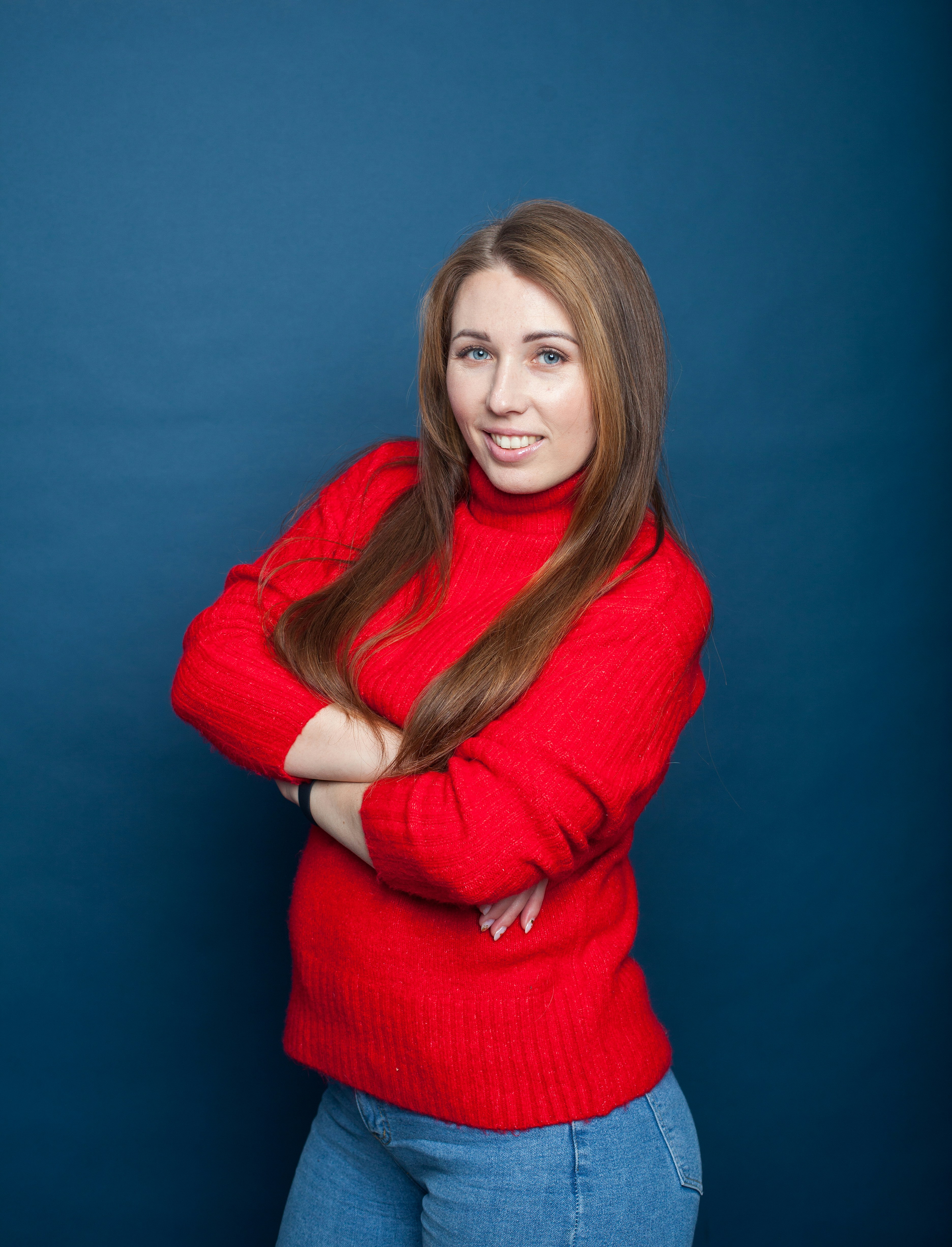 a woman with her arms crossed