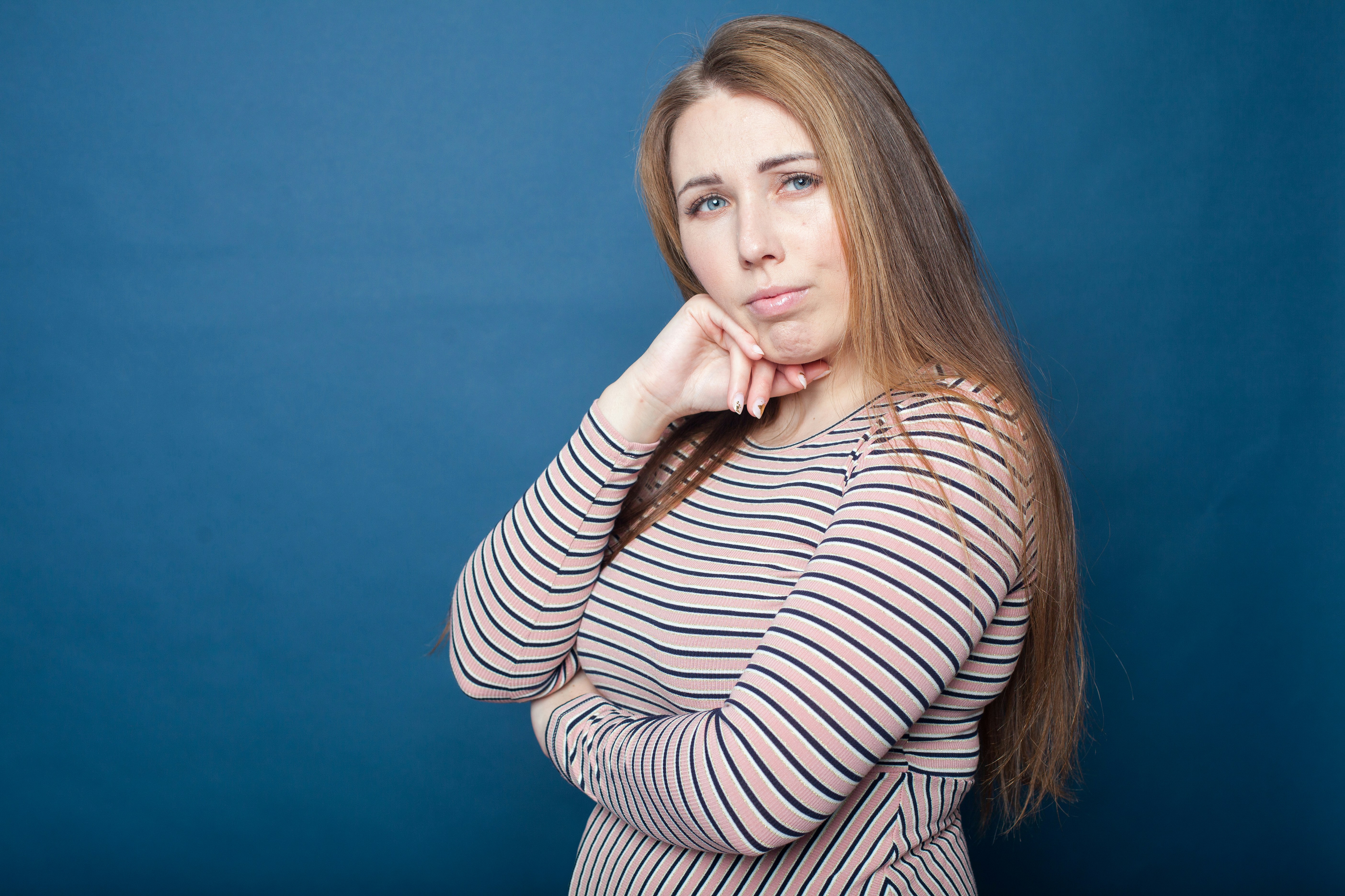 Frustrated woman looking at scale