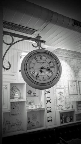 Decorative wall clock featuring traditional Batak gorga motifs hanging in a cozy room.