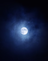 A mystical night sky filled with stars and a full moon.