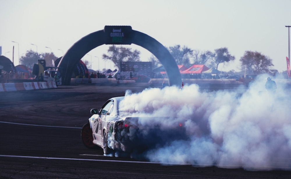 a race car with smoke coming out of it