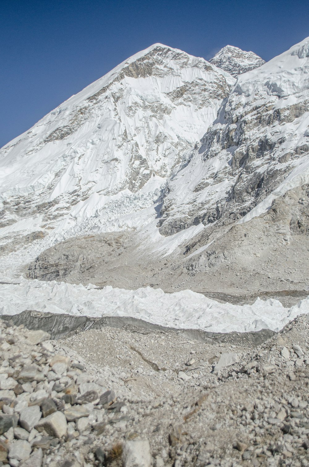 a rocky mountain with snow