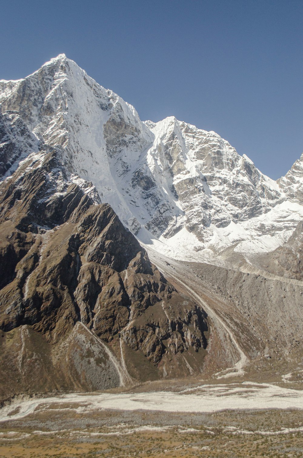 a rocky mountain with snow