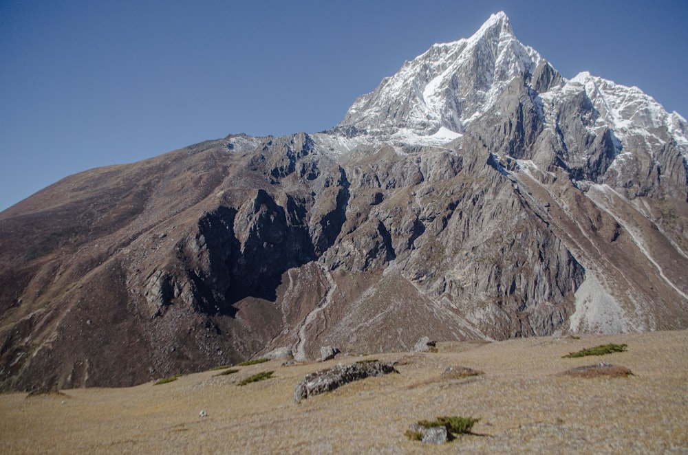 a rocky mountain with snow