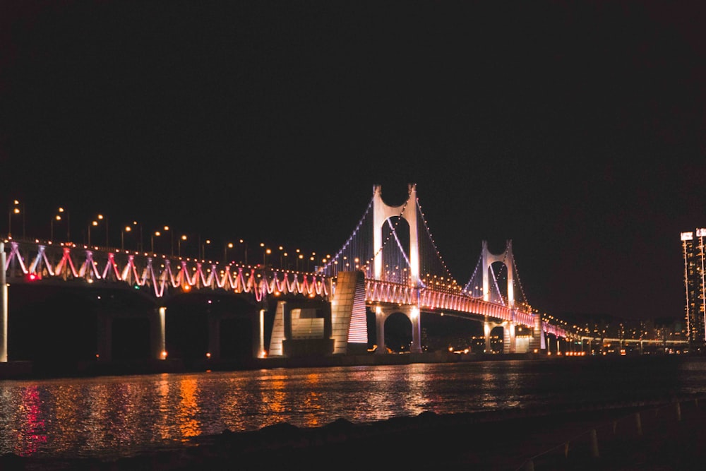 a bridge with lights at night