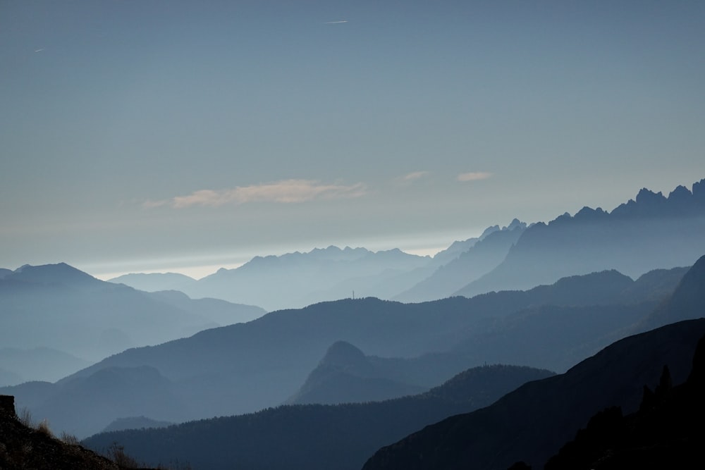 a view of mountains and trees