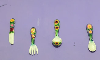 A vibrant set of kitchen tools including spatulas, ladles, and cutting boards in cheerful colors.