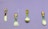 Four colorful utensils are arranged against a light purple background. Each utensil features a different floral pattern with vibrant yellows, greens, and reds. The utensils include a knife, a fork, a ladle, and a spoon.