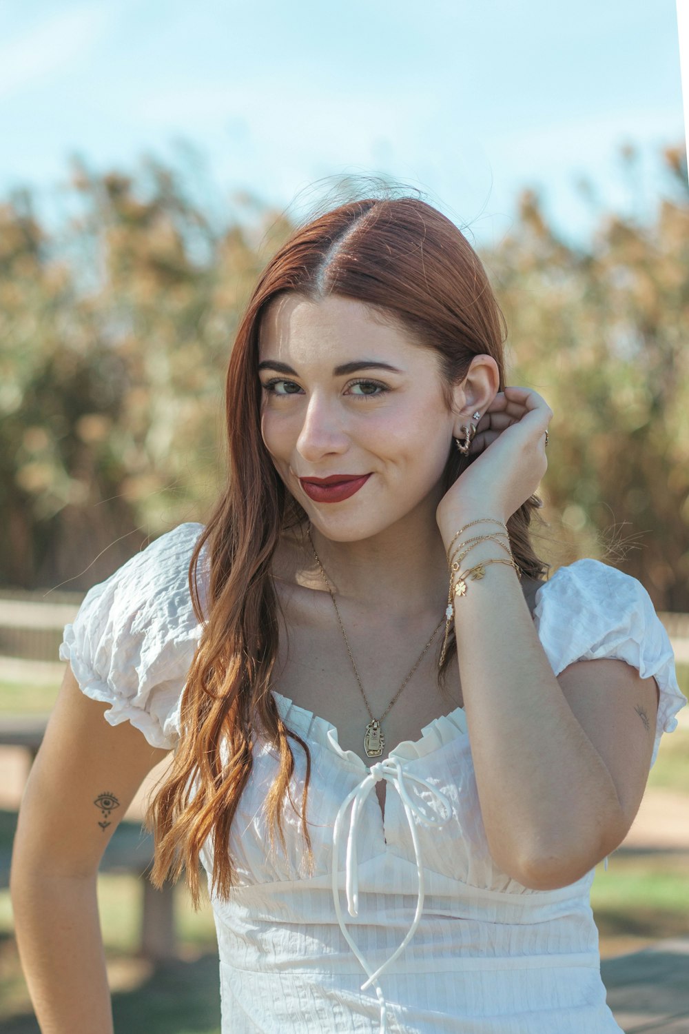 a woman with her hand on her face