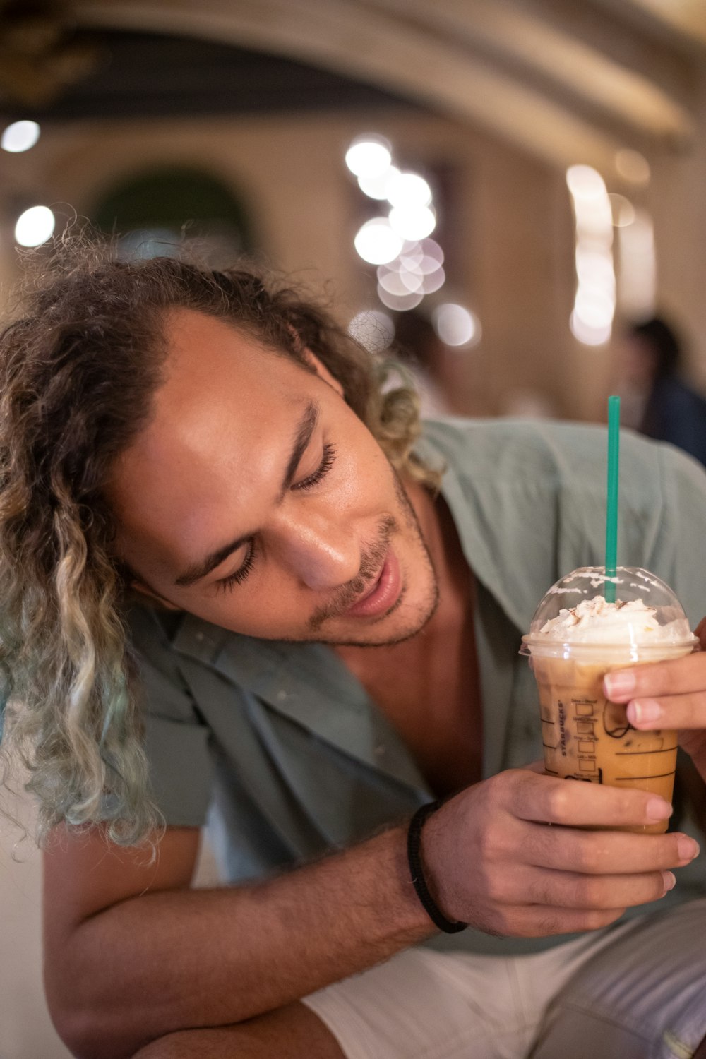 a person drinking from a straw