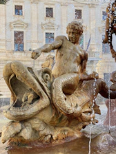 Ancient mythological scene depicting Aphrodite and Eros transforming into fishes to escape danger.