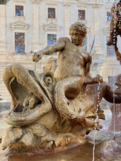 A dramatic illustration of a kraken rising from the waters, inspired by Greek mythology.