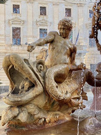 Ancient mythological scene depicting Aphrodite and Eros transforming into fishes to escape danger.