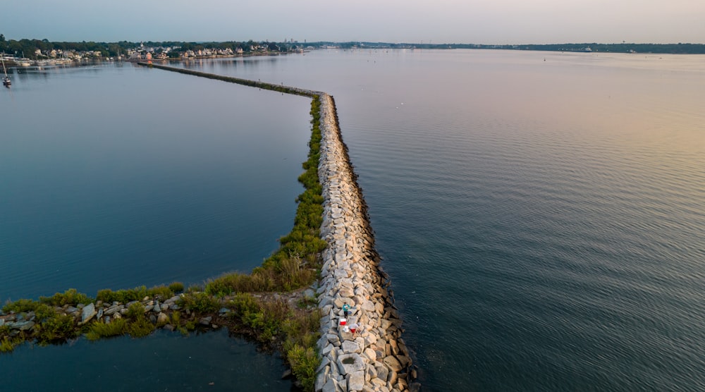 a body of water with land and trees around it