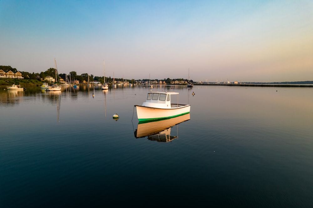 a boat sits in the middle of a body of water