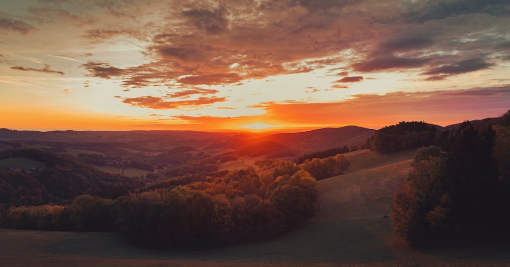 a sunset over a mountain range