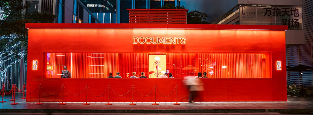 a red building with a sign on it