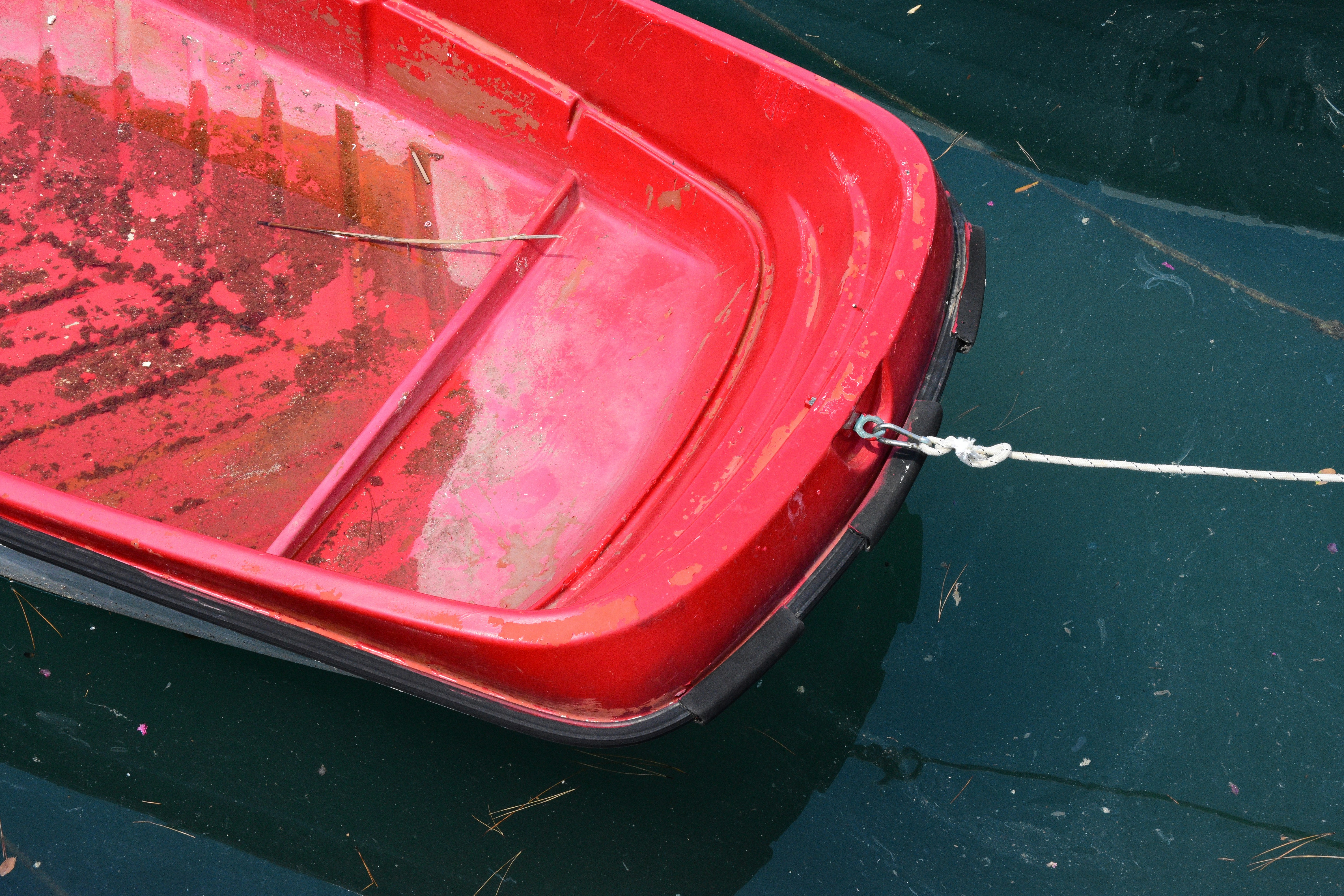 A red car with a rope photo Free Boat Image on Unsplash