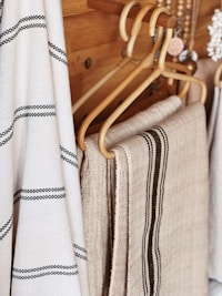 a pair of white and brown striped pants on a swinger