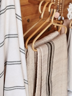 a pair of white and brown striped pants on a swinger