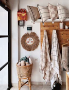 Delicate linear illustration of a cozy corner with soft cushions and toys.