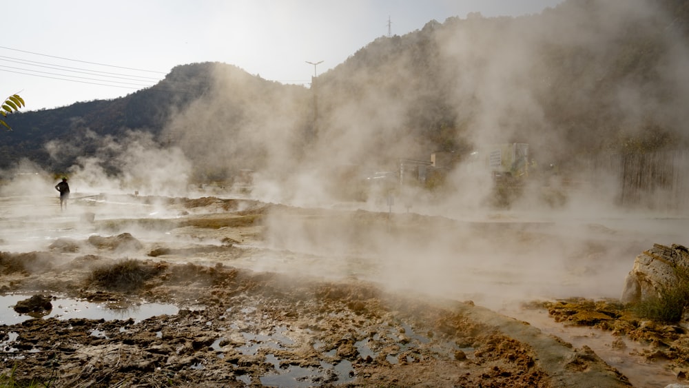 a person walking in a muddy area