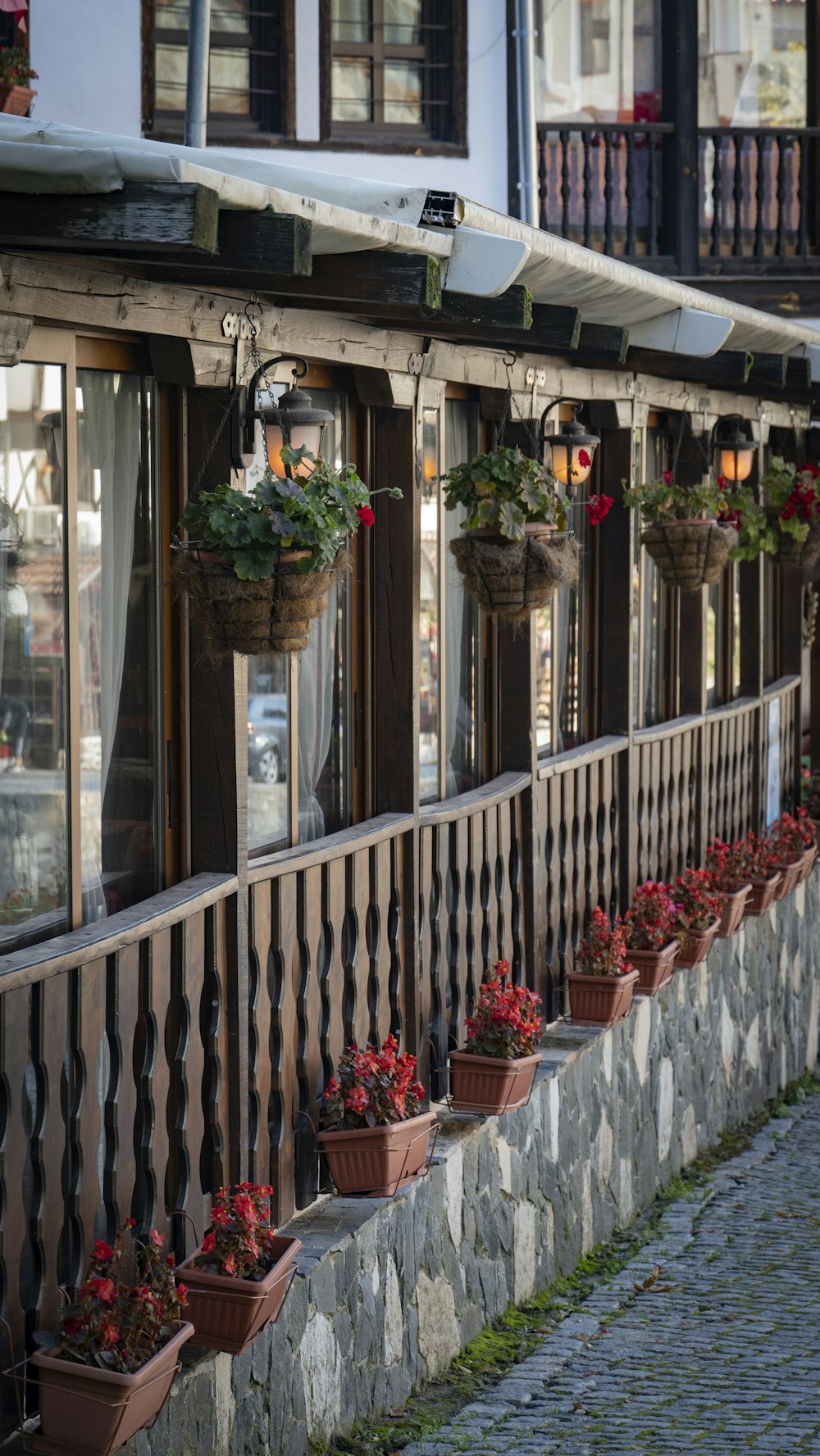 a building with many potted plants