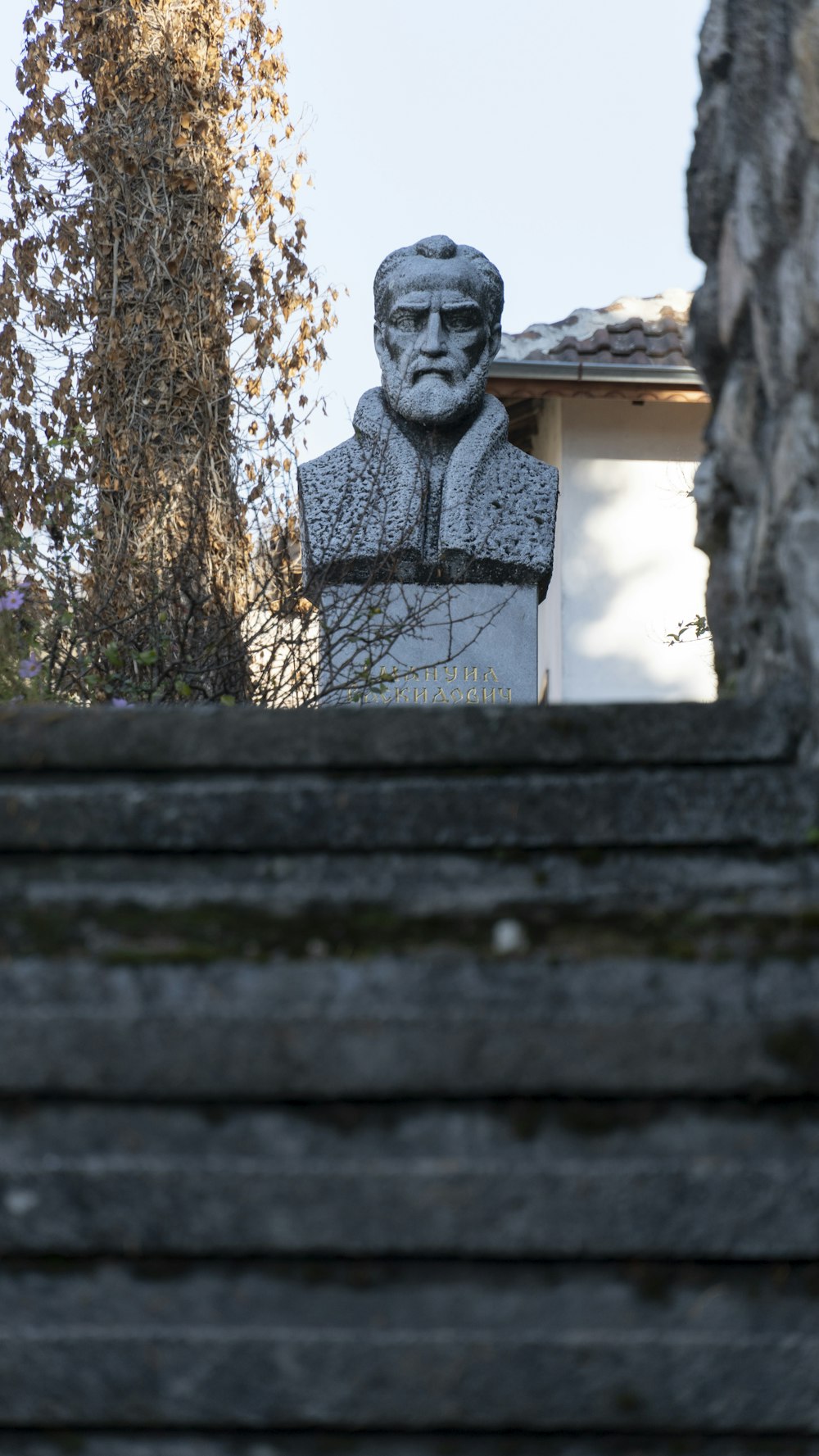 a stone statue on a wall