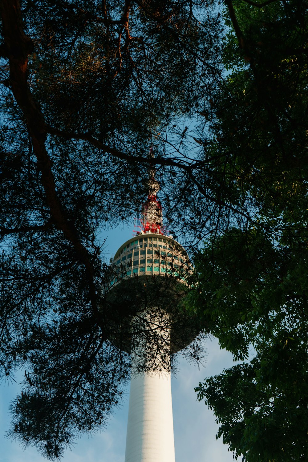 a tall tower with a statue on top