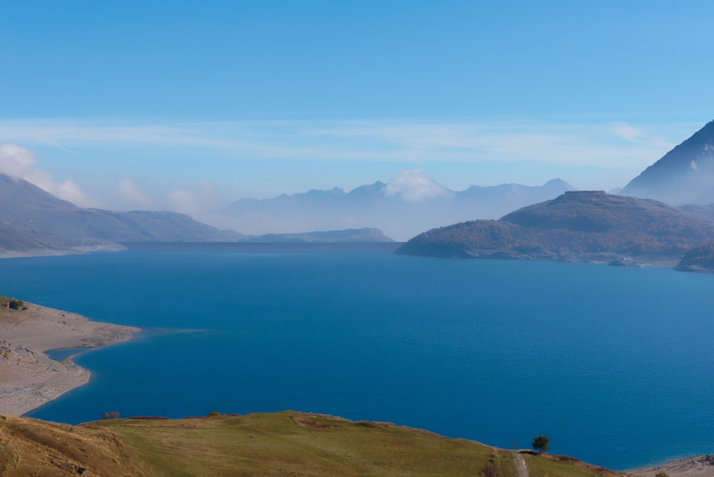 a body of water with hills around it