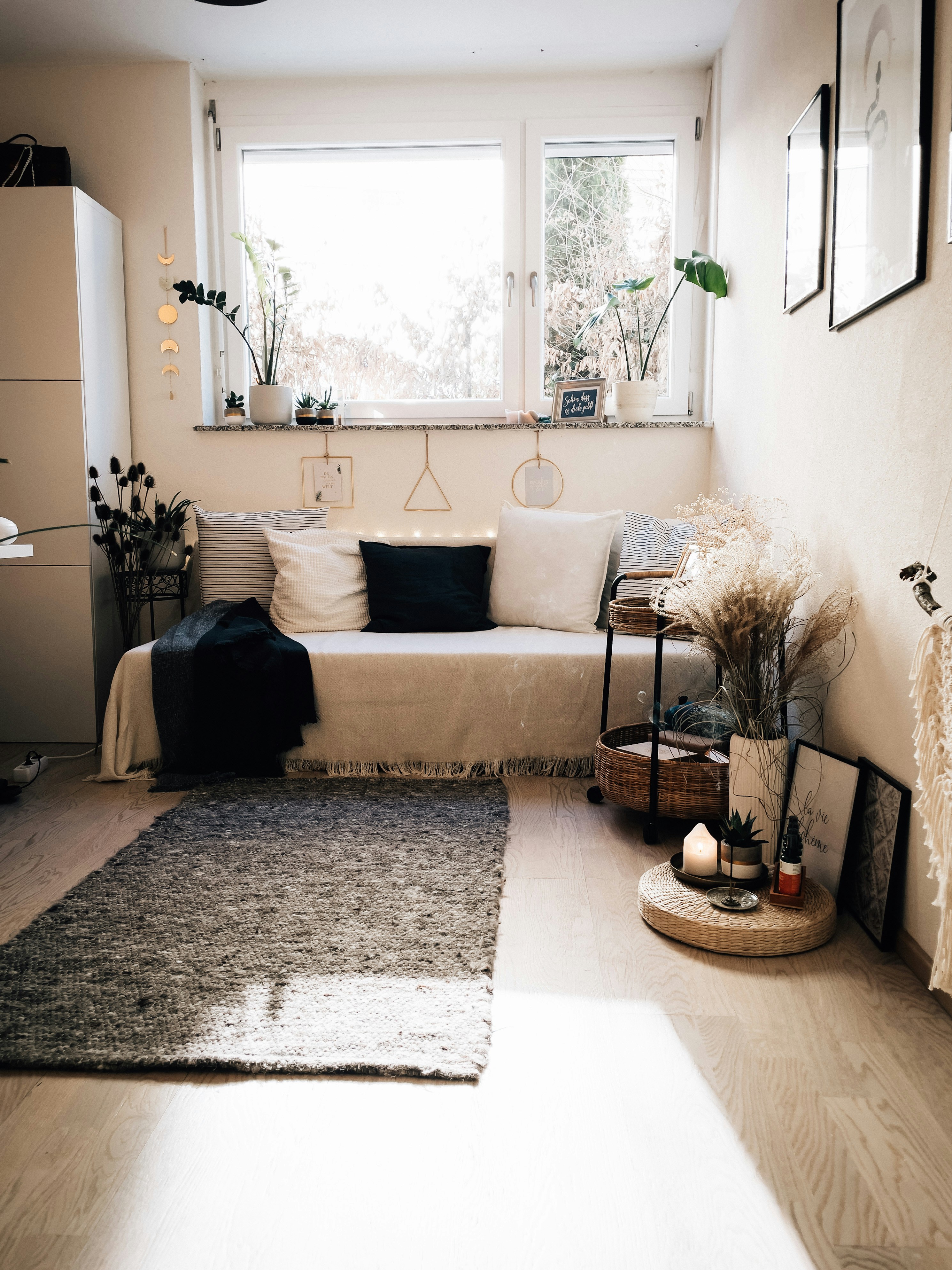 a living room with a couch and a rug