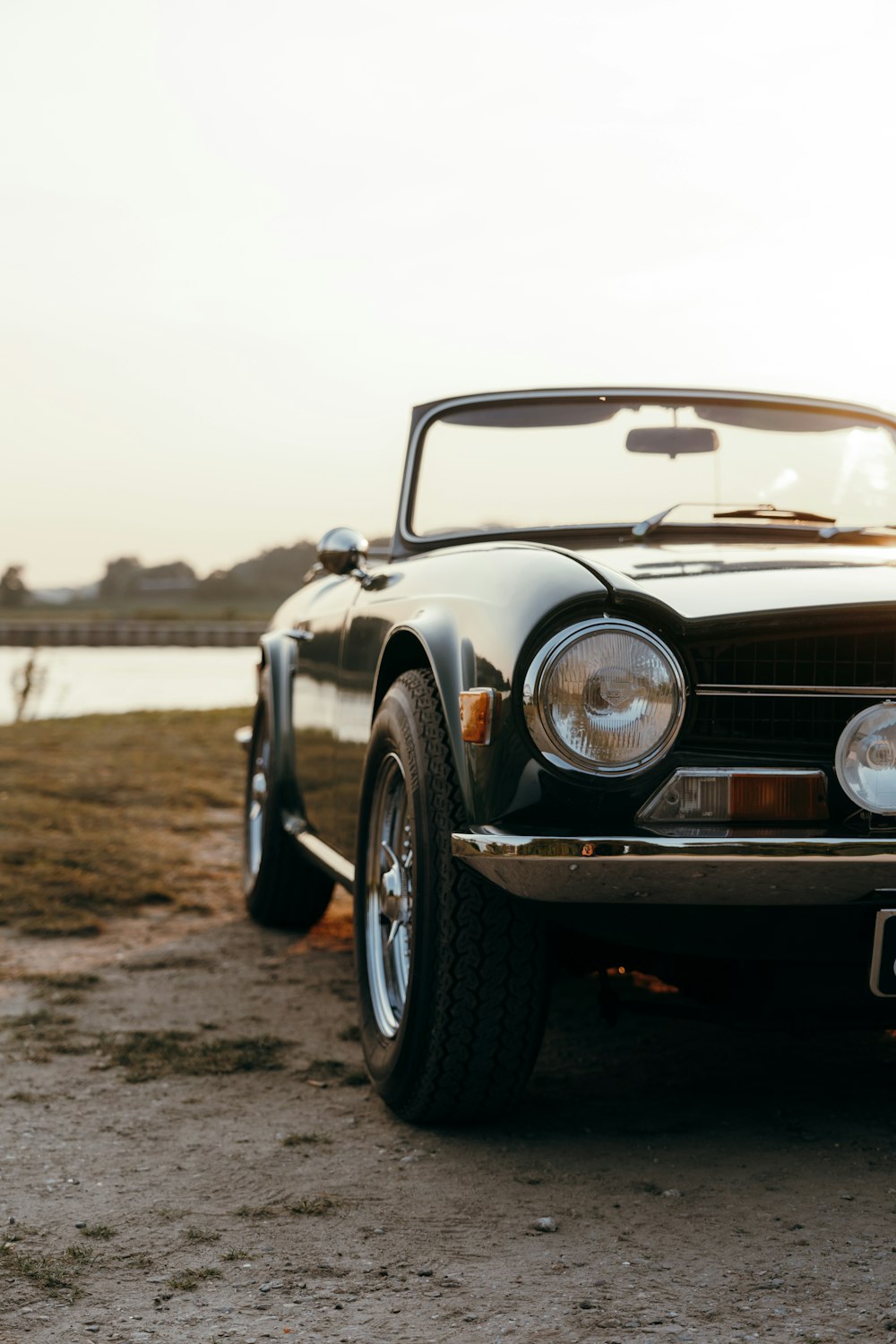 a car parked on a dirt road