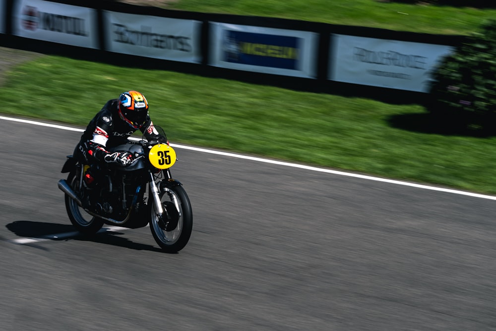 a man riding a motorcycle on a race track