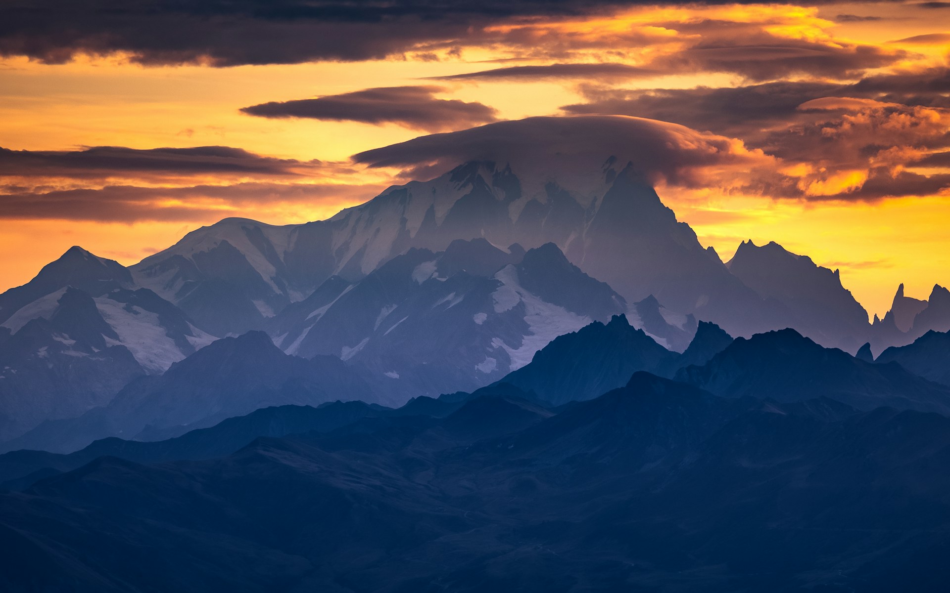 woman wearing yellow long-sleeved dress under white clouds and blue sky during daytime